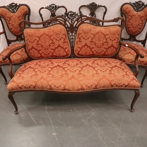 553 - Victorian walnut framed salon suite comprising a two-seat settee, two elbow chairs and two further c... 