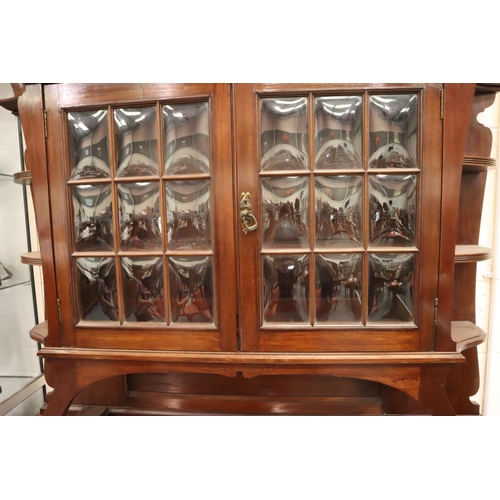 559 - A 19th century Art Nouveau mahogany dresser comprising a base of cupboard and drawers, top section s... 