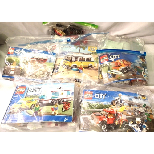 2225 - Seven Lego vehicles; car and caravan, tow truck, fire engine, campervan, garbage truck (some missing... 