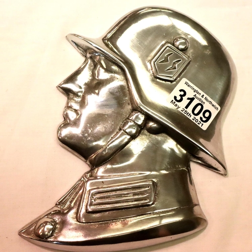 3113 - A polished metal SS soldiers side profile, wall or door mounting with threaded holes verso, H: 21 cm... 