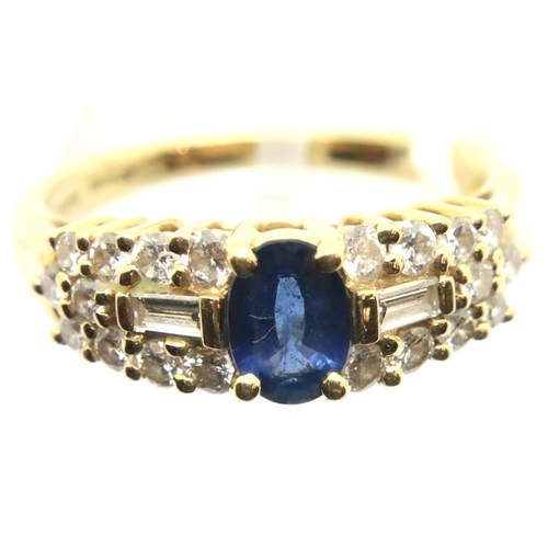 33 - A Contemporary 18ct gold sapphire and diamond set cocktail ring, the single central oval sapphire of... 