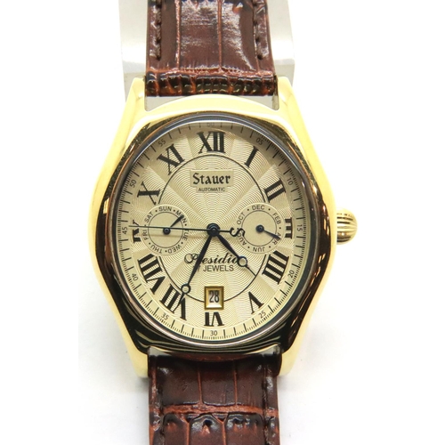 64 - Gents Stauer automatic wristwatch in original box and paperwork, with cream dial in good working ord... 