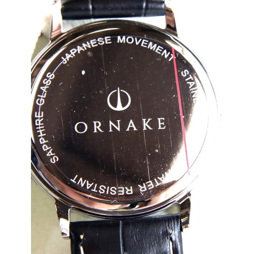 84 - New and boxed Ornake gents wristwatch with white dial and leather strap. P&P Group 1 (£14+VAT for th... 