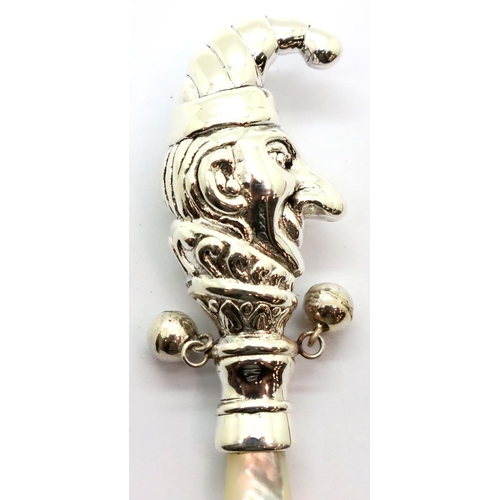 125 - Sterling silver Mr Punch baby rattle with mother of pearl grip, L: 95 mm. P&P Group 1 (£14+VAT for t... 