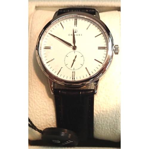 1097 - Boxed Ornake gents wristwatch stainless steel with white dial. P&P Group 1 (£14+VAT for the first lo... 
