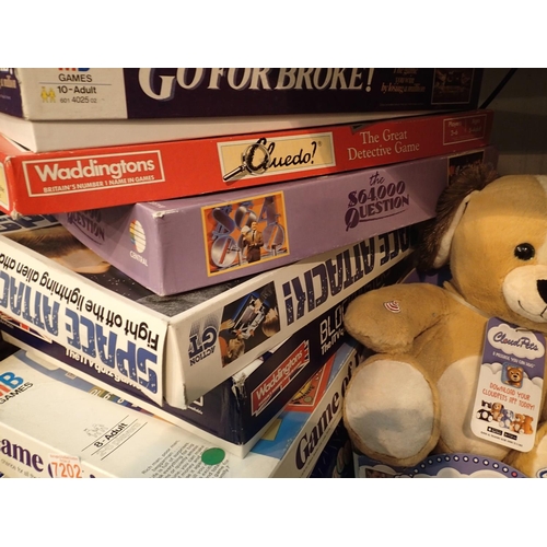 1146 - Shelf of mixed board games including Blockbusters and a soft toy. Not available for in-house P&P, co... 