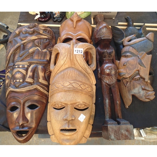 1212 - Collection of African style masks and figurine. Not available for in-house P&P, contact Paul O'Hea a... 