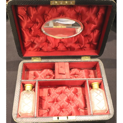 326 - Victorian leather dressing case with fitted interior, including mirror, containing two perfume bottl... 