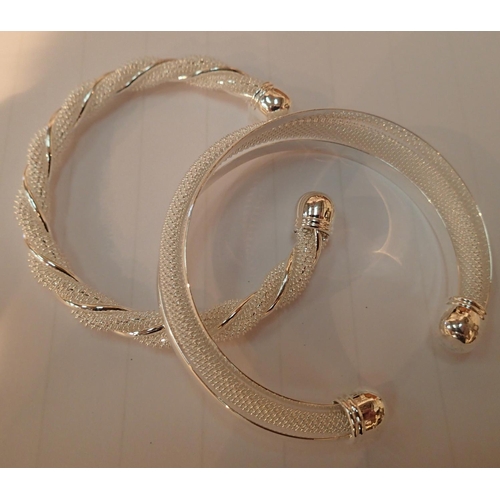1075A - Two white metal torc bracelets. P&P Group 1 (£14+VAT for the first lot and £1+VAT for subsequent lot... 