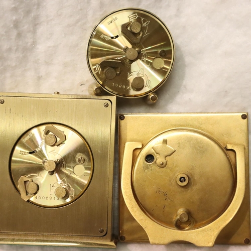 343 - Looping, an eight day eighteen jewel brass cased alarm clock, a further Looping travel clock, a Swiz... 