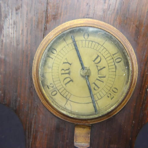 344 - An Edwardian walnut framed aneroid barometer with thermometer, mirror and level, H: 93 cm. Not avail... 