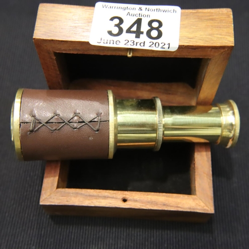 348 - Boxed small brass and leather two draw telescope, extended, L: 10 cm. P&P Group 1 (£14+VAT for the f... 