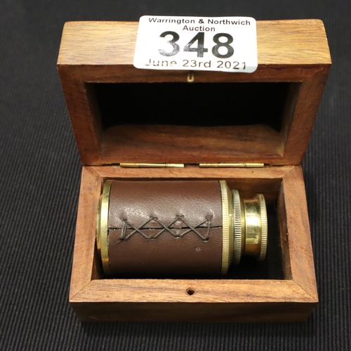 348 - Boxed small brass and leather two draw telescope, extended, L: 10 cm. P&P Group 1 (£14+VAT for the f... 