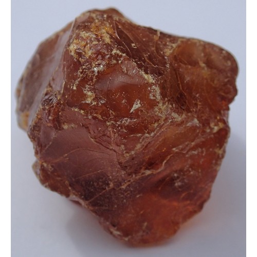 1112 - Large piece of unpolished amber coloured stone believed to be resinous amber, to weigh 58g. P&P Grou... 