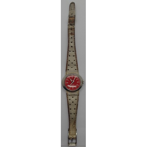 59 - Ladies Omega orange face wristwatch with integral leather strap. Watch working, strap tatty. P&P Gro... 