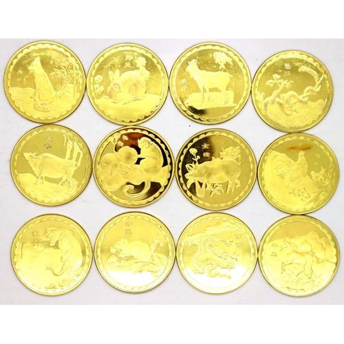 3101 - Twelve Gold Plated rounds of the Zodiac signs. P&P Group 1 (£14+VAT for the first lot and £1+VAT for... 