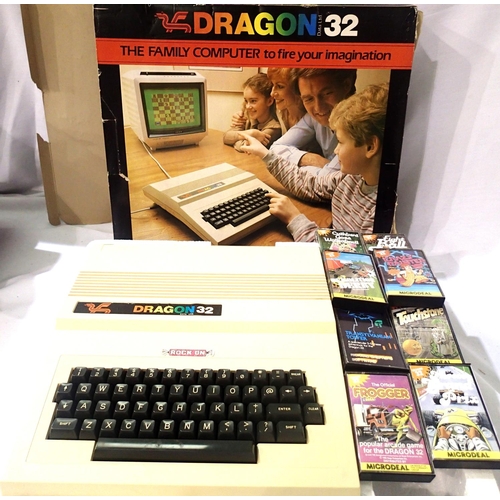 2172 - Dragon 32 computer with cover, box and eight game cassettes. P&P Group 1 (£14+VAT for the first lot ... 