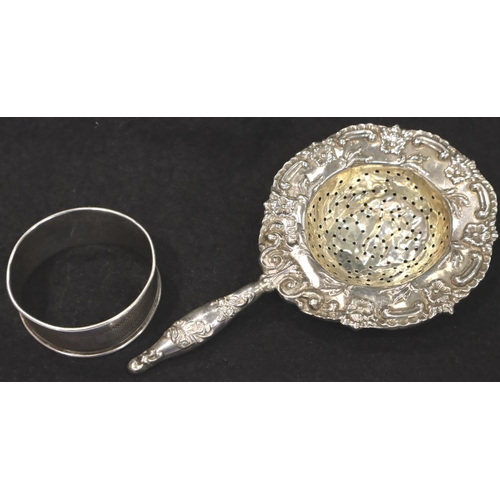 110 - Hallmarked silver tea strainer, Chester assay, some creasing to bowl and a silver napkin ring. P&P G... 