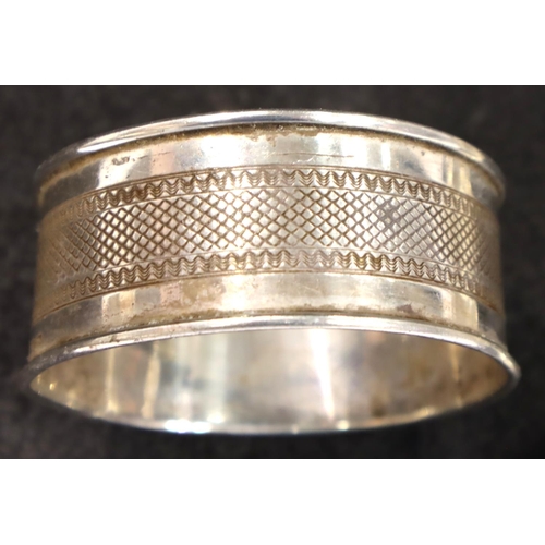 110 - Hallmarked silver tea strainer, Chester assay, some creasing to bowl and a silver napkin ring. P&P G... 