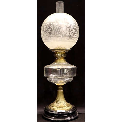 241 - A 19th century oil lamp , the brass and glass base supporting the clear glass reservoir duplex burne... 