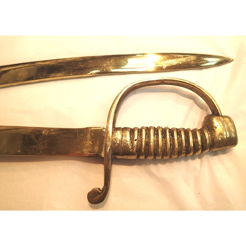 1137 - Pair of heavy cast brass sabres, blade L: 75 cm. Not available for in-house P&P, contact Paul O'Hea ... 