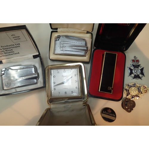 1074B - Mixed lot of three boxed lighters and a travel clock. P&P Group 1 (£14+VAT for the first lot and £1+... 