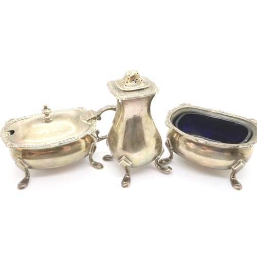 120 - Hallmarked silver cruet comprising open salt, mustard and pepper with blue glass liner, London assay... 