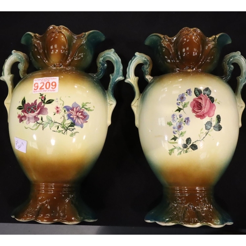 168 - Two Victorian ceramic vases with green glaze and gilt highlights each with cameo pictures of young l... 