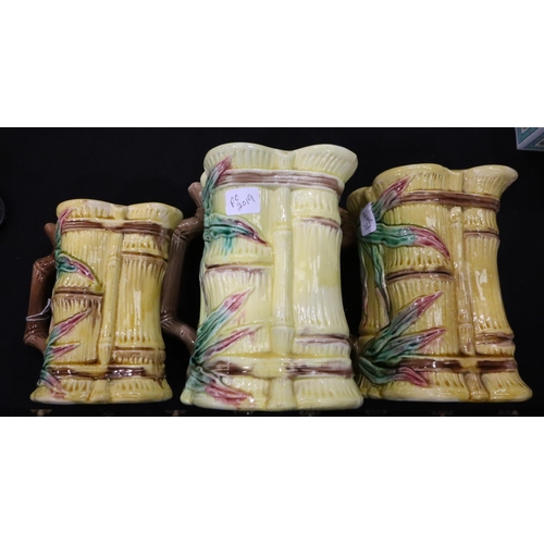 199 - A set of three graduated jugs each decorated with bamboo. Not available for in-house P&P, contact Pa... 