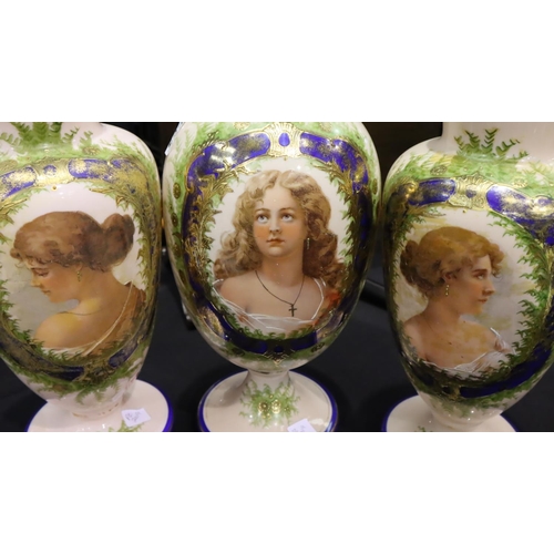 234 - A set of three Victorian pink glass cameo vases with blue and gilt highlights each with the portrait... 