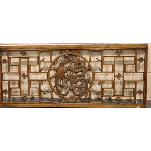 277 - 19th Century Chinese fretwork wooden panel with dragon and phoenix central motif, 49 x 112 cm. Not a... 