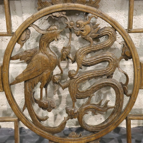 277 - 19th Century Chinese fretwork wooden panel with dragon and phoenix central motif, 49 x 112 cm. Not a... 