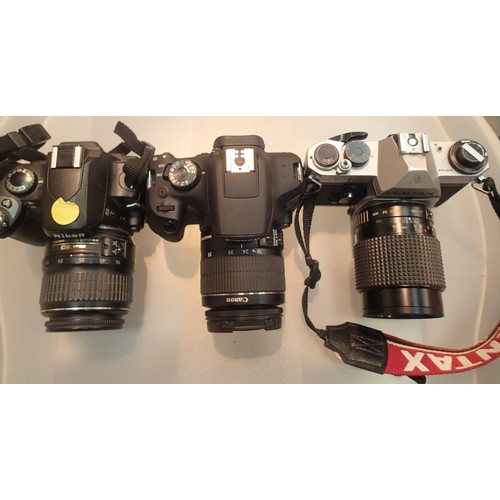 1112 - A Nikon DX digital camera and a Pentax Asahi camera and a Canon EOS 2000D digital camera. P&P Group ... 