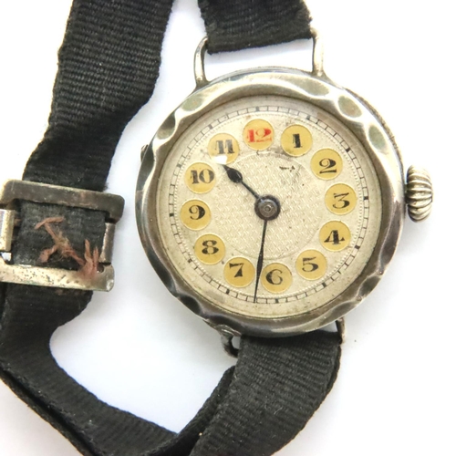 104 - WWI type silver wristwatch with red 12 dial, not working at lotting. P&P Group 1 (£14+VAT for the fi... 