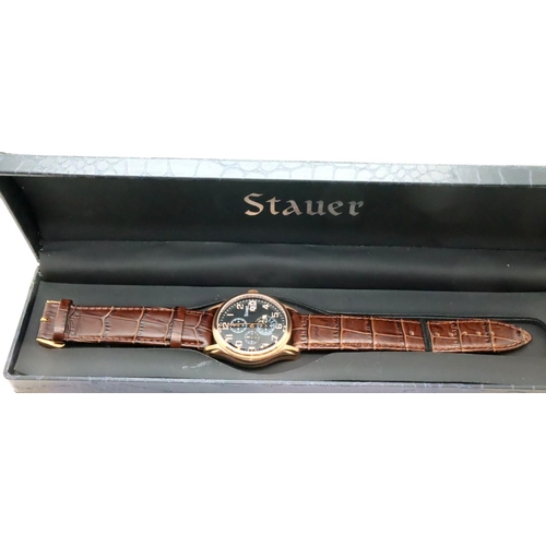 108 - Stauer; gents wristwatch with black dial, brown leather strap and gold plated case with box and oute... 