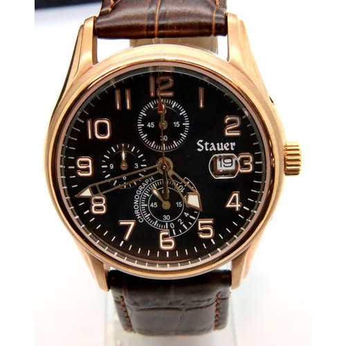 108 - Stauer; gents wristwatch with black dial, brown leather strap and gold plated case with box and oute... 