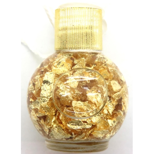 57 - Small bottle of loose gold leaf. P&P Group 1 (£14+VAT for the first lot and £1+VAT for subsequent lo... 