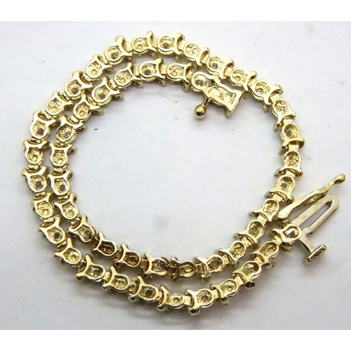 63 - 9ct gold and diamond tennis bracelet, L: 14 cm, 3.6g. P&P Group 1 (£14+VAT for the first lot and £1+... 