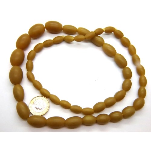 66 - Butterscotch amber bead necklace, L: 72 cm, largest bead: 31 mm. P&P Group 1 (£14+VAT for the first ... 