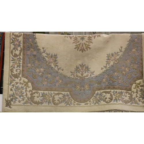 457 - Large beige ground woollen rug. Not available for in-house P&P, contact Paul O'Hea at Mailboxes on 0... 