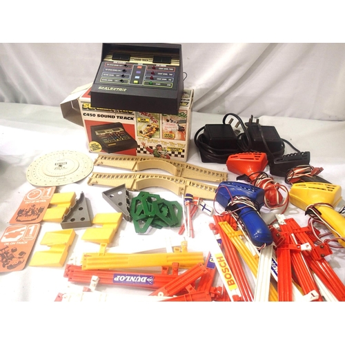 2092 - Scalextric C450 soundtrack accessories/boxed, plus two transformers, four controllers, crash barrier... 