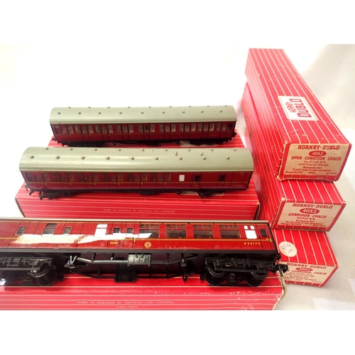 2066 - Hornby Dublo 4083 and 4084 Suburban Maroon coaches and a BR Maroon B/End 4053, all in fair condition... 