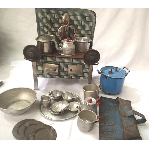 2076 - Tinplate toy stove, spirit fired, complete with pots, kettle etc, in fair to good condition, 20 x 14... 