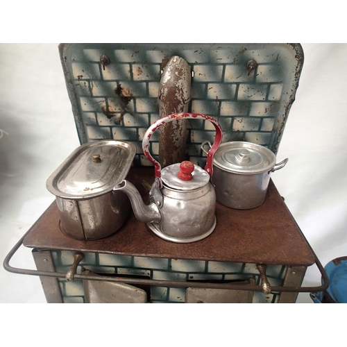 2076 - Tinplate toy stove, spirit fired, complete with pots, kettle etc, in fair to good condition, 20 x 14... 