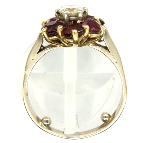 68 - 18ct gold diamond and ruby flower ring, size I, 3.7g. P&P Group 1 (£14+VAT for the first lot and £1+... 