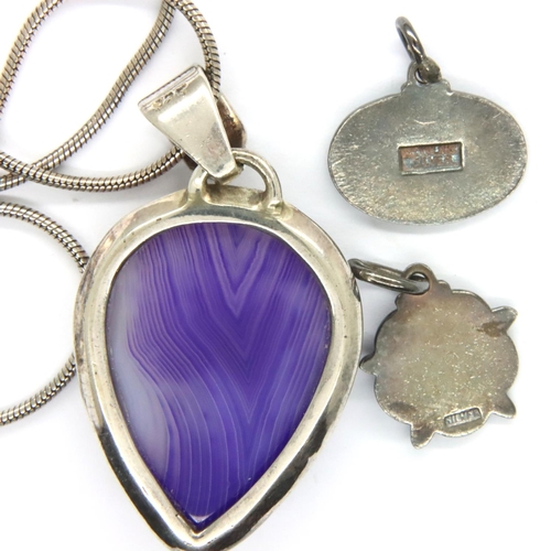 71 - Silver pendant and chain set with a purple stone and two small silver pendants. P&P Group 1 (£14+VAT... 