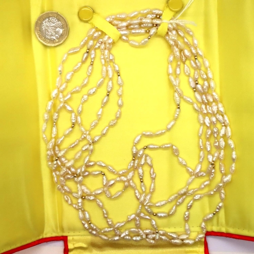 85 - Set of freshwater pearls set with yellow metal ball spacers. P&P Group 1 (£14+VAT for the first lot ... 