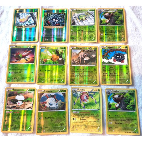 2130 - Collection of assorted Fire and Grass Pokemon trading cards including shiny / holographic examples; ... 