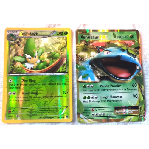 2130 - Collection of assorted Fire and Grass Pokemon trading cards including shiny / holographic examples; ... 