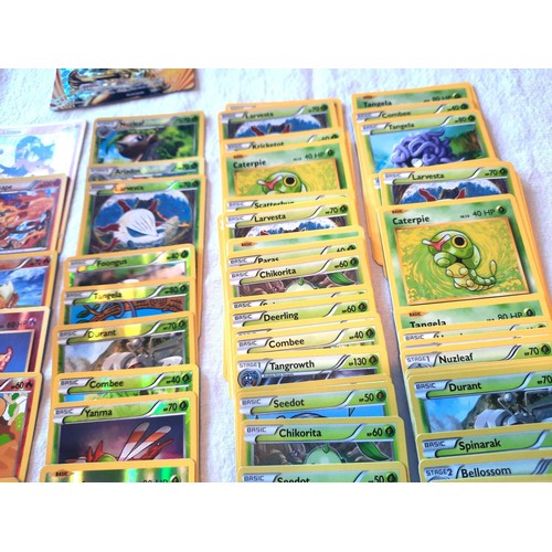 2130 - Collection of assorted Fire and Grass Pokemon trading cards including shiny / holographic examples; ... 